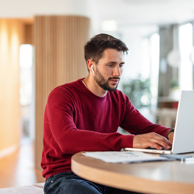 A person on a laptop looking up information
